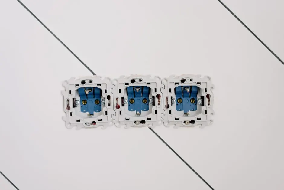 Power sockets with various connectors and bolts on wall in room at home